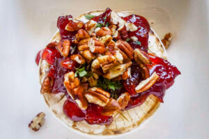 Baked brie with quince, pecans and springs of thyme