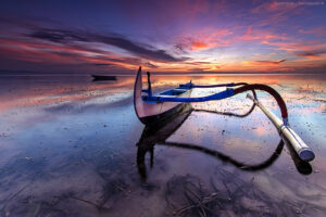sanur Local boat on the beach at sunset