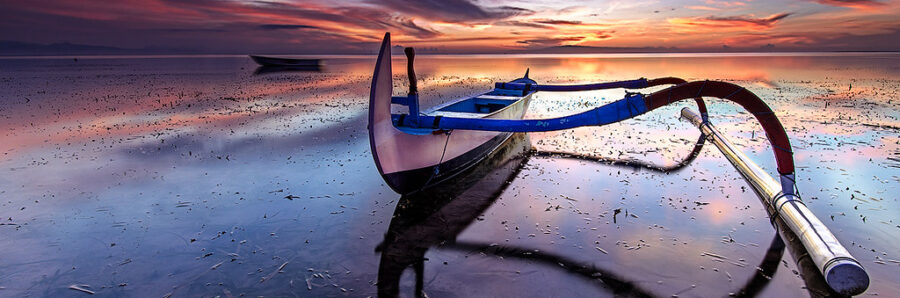 sanur Local boat on the beach at sunset