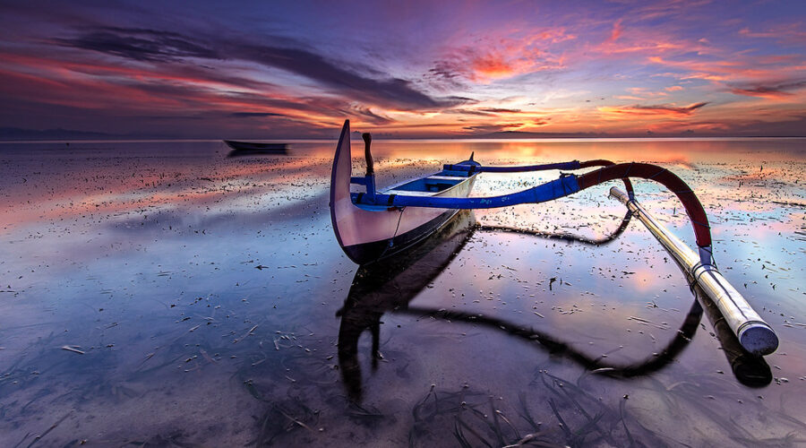 sanur Local boat on the beach at sunset